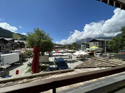 a view of a parking lot with umbrellas and tents at SL127 - 2 Pièces 4 Pers centre Carroz in Les Carroz d'Araches
