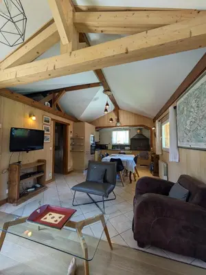 a living room with a couch and a table at Le Bivouac in Chamonix-Mont-Blanc