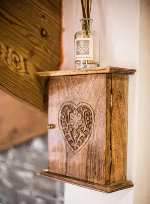 a wooden box with a heart on a wall at Chalet 1155 - Montroc - Chamonix in Chamonix-Mont-Blanc
