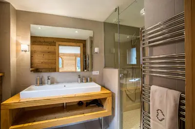 a bathroom with a sink and a shower at Chalet 1155 - Montroc - Chamonix in Chamonix-Mont-Blanc