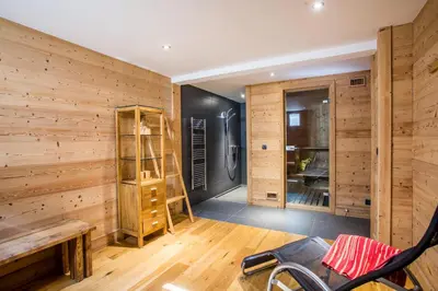 a room with wooden walls and a desk and a chair at Chalet 1155 - Montroc - Chamonix in Chamonix-Mont-Blanc