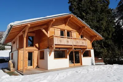 a log cabin in the snow with snow at Prestigious Chalet in Saint-Gervais-les-Bains
