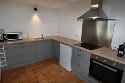 a kitchen with a sink and a stove top oven at Face Mont-Blanc in Passy