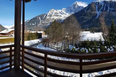 a view from a balcony with snow covered mountains at Résidence Luxe 5*,Spa & Fitness, La Cordée Appartement 821 in Chamonix-Mont-Blanc