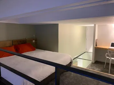 a bedroom with two beds and a glass floor at Flaine Forum L1 Cassiopée Mezzanine & Terrasse in Flaine