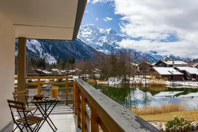a balcony with a view of a snow covered mountain at La Cordee 612 apartment- Chamonix All Year in Chamonix-Mont-Blanc