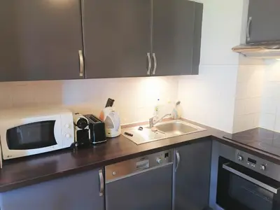 a kitchen with a microwave and a sink at Charmant Duplex 3 Chambres à 100m des Pistes, Parking, WIFI - FR-1-815-73 in Morillon