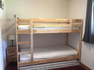 a couple of bunk beds in a room at Charmant Duplex 3 Chambres à 100m des Pistes, Parking, WIFI - FR-1-815-73 in Morillon