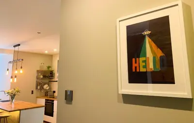 a picture of ahelp sign on the wall of a kitchen at Apartment Chinook,La Praz,Chamonix Mont Blanc in Chamonix-Mont-Blanc