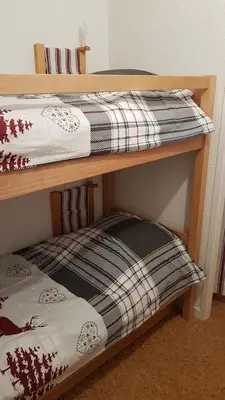 a couple of bunk beds in a room at Le Duplex Septimontain in Samoëns
