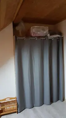 a metal curtain in the corner of a room at Le Duplex Septimontain in Samoëns