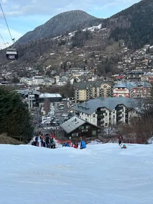 a mountain covered in snow with trees in the foreground at Grand Panorama T2 aux pieds des télécabines 
