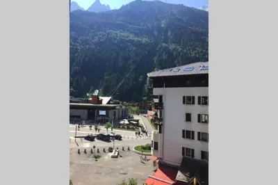 a view of a building with mountains in the background at Le Mallory in Chamonix-Mont-Blanc