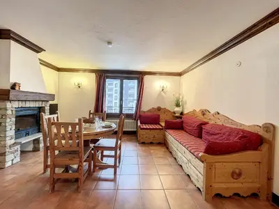 a living room with a couch and a table at Appartement cosy au centre de Chamonix avec parking - FR-1-507-42 in Chamonix-Mont-Blanc
