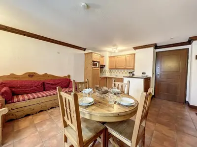 a kitchen and dining room with a table and chairs at Appartement cosy au centre de Chamonix avec parking - FR-1-507-42 in Chamonix-Mont-Blanc