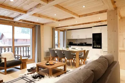 a living room with a couch and a table at Residence la Blaitiere in Chamonix-Mont-Blanc