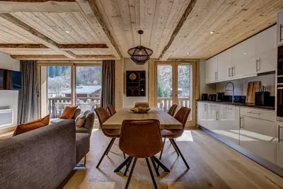 a kitchen and dining room with a table and chairs at Residence la Blaitiere in Chamonix-Mont-Blanc