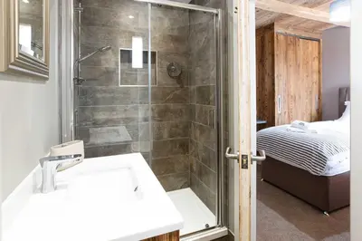 a bathroom with a shower and a sink at Chalet des Amis appt 1 - Chamonix All Year in Chamonix-Mont-Blanc