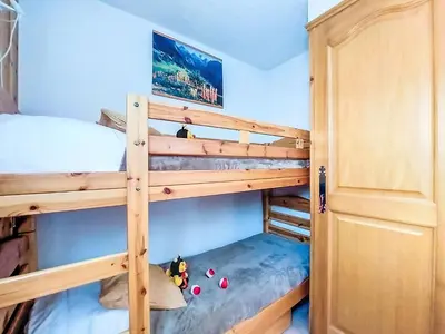 a bunk bed room with two bunk beds and a door at Apartment Jardins Alpins by Interhome in Saint-Gervais-les-Bains