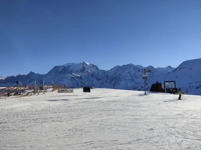 a snow covered slope with mountains in the background at Apartment Jardins Alpins by Interhome in Saint-Gervais-les-Bains