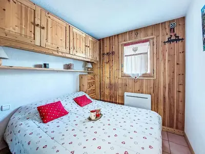 a bedroom with two bunk beds and a desk at Apartment Jardins Alpins by Interhome in Saint-Gervais-les-Bains