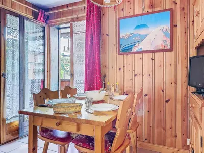 a living room with a couch and a table at Apartment Jardins Alpins by Interhome in Saint-Gervais-les-Bains