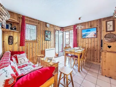 a wooden dining room with a table and chairs at Apartment Jardins Alpins by Interhome in Saint-Gervais-les-Bains