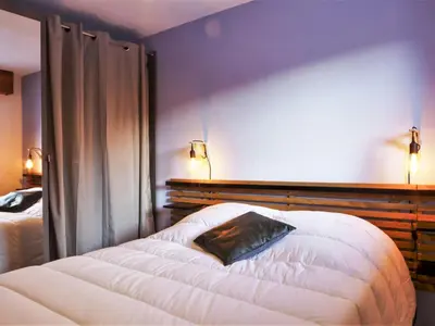 a bedroom with a large white bed with a pillow at Apartment L'Espace Montagne-16 by Interhome in Chamonix-Mont-Blanc