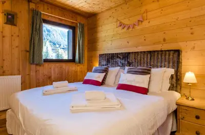 a living room with couches and a coffee table at Les Clochettes in Megève