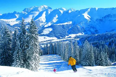 a person on skis in the snow on a mountain at Les Clochettes in Megève
