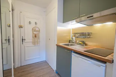 a kitchen with a sink and a counter top at Studio rénové dans le centre piéton de Megève in Megève