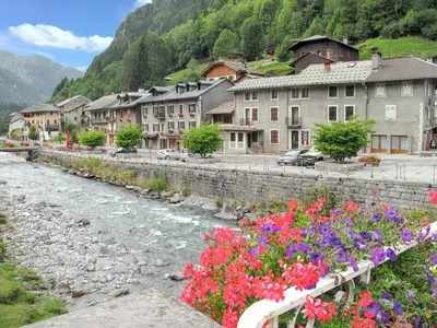 a bunch of flowers on a bridge over a river at Chalet cosy à Sixt-Fer-à-Cheval avec vue sur la montagne in Sixt