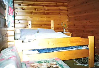 a wooden room with two bunk beds in it at Chalet cosy à Sixt-Fer-à-Cheval avec vue sur la montagne in Sixt