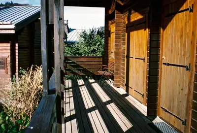 an entrance to a building with a wooden deck at Chalet cosy à Sixt-Fer-à-Cheval avec vue sur la montagne in Sixt