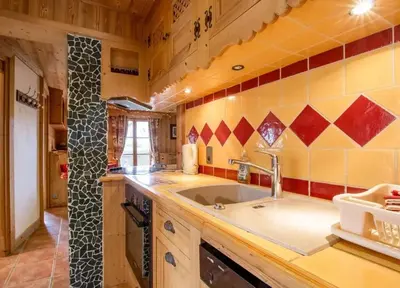 a kitchen with a sink and a counter at Appartement confortable à Megève | 46m² | Vue sur montagne in Megève