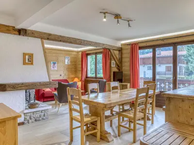 a kitchen and dining room with a wooden table and chairs at Appartement Megève Jaillet, 2 Chambres, Balcon, Parking - FR-1-453-226 in Megève