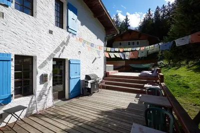 a porch of a building with a door and a deck at Chamonix Lodge in Chamonix-Mont-Blanc