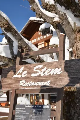 a sign that says le sign returnowment in the snow at Hotel Le Christiania in Les Contamines-Montjoie