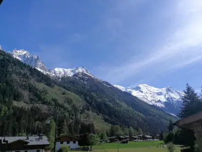 a mountain range with snow covered mountains at Le Chamoniard Volant in Chamonix-Mont-Blanc