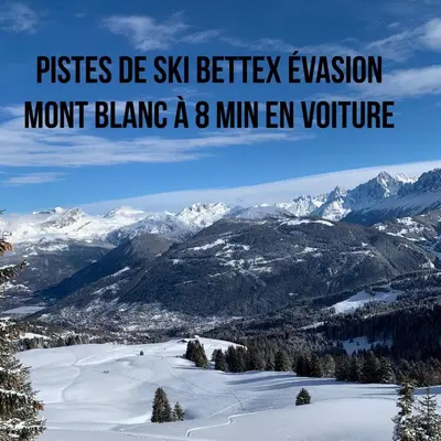 a hallway with a door and a picture on the wall at Studio Turquoise quartier Grattague vue MontBlanc in Saint-Gervais-les-Bains