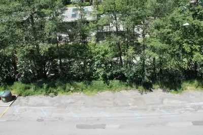 an aerial view of a parking lot with blue markings at Appt cosy au centre de Chamonix in Chamonix-Mont-Blanc