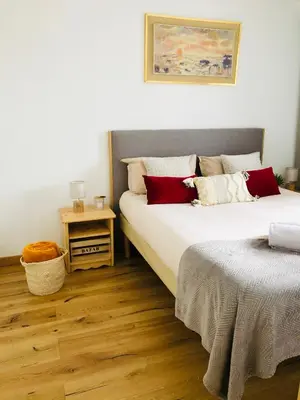 a bedroom with two beds and a night stand at Mont Blanc 43, vue Mont Blanc , balcon, parking in Chamonix-Mont-Blanc