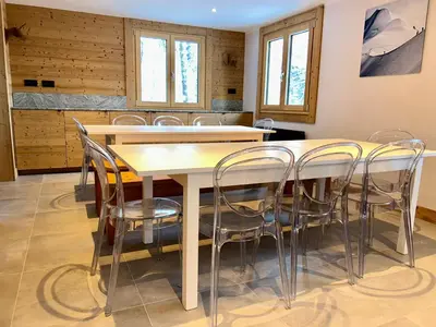 a dining room with a table and chairs at 4 Bedroom, 4 Bathroom, Hot Tub, Chamonix Centre in Chamonix-Mont-Blanc
