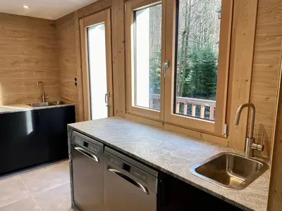 a kitchen with a sink and a window at 4 Bedroom, 4 Bathroom, Hot Tub, Chamonix Centre in Chamonix-Mont-Blanc