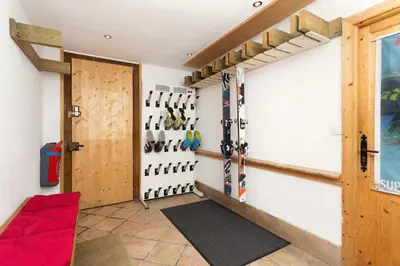 a room with skis on the wall and a door at 4 Bedroom, 4 Bathroom, Hot Tub, Chamonix Centre in Chamonix-Mont-Blanc