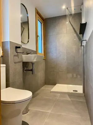 a bathroom with a toilet and a sink and a shower at 4 Bedroom, 4 Bathroom, Hot Tub, Chamonix Centre in Chamonix-Mont-Blanc