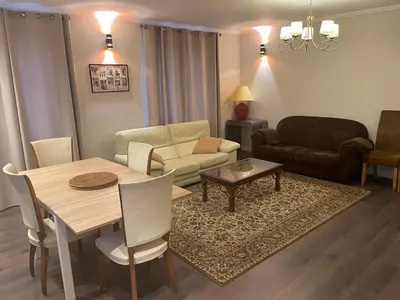 a living room with a table and a couch at Nant d Ant in Samoëns