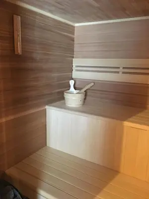 a wooden wall with a bowl on a shelf at Les Ours de Combloux in Combloux
