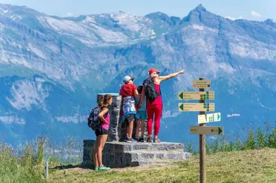 a group of people standing on the top of a mountain at Appartement spacieux proche des télécabines et du centre ville avec jardin privé in Saint-Gervais-les-Bains