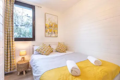 a bedroom with two beds and a window at Appartement Cham-Vue in Chamonix-Mont-Blanc